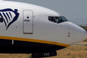 Ryanair's corporate logo is displayed on a Boeing 737 plane next to the cockpit at the airport, one day before a cabin crew strike to be held in four European countries on July 25 and 26, in Valencia
