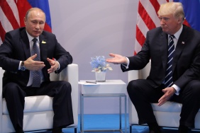 Russia's President Vladimir Putin talks to U.S. President Donald Trump during their bilateral meeting at the G20 summit in Hamburg