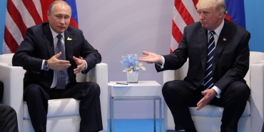 Russia's President Vladimir Putin talks to U.S. President Donald Trump during their bilateral meeting at the G20 summit in Hamburg