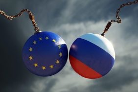 Wrecking Balls Textured with European Union and Russian Flags Over Dark Stormy Sky